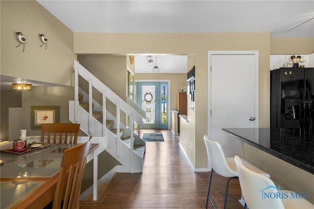 entryway with hardwood / wood-style floors