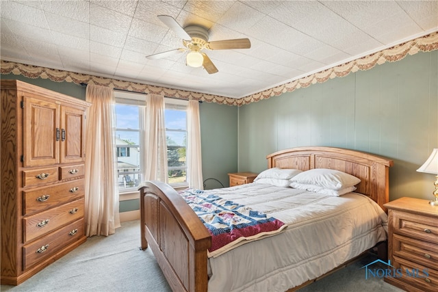 bedroom featuring ceiling fan and light colored carpet