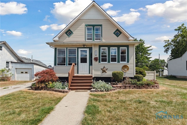 view of front of house featuring a garage and a front lawn