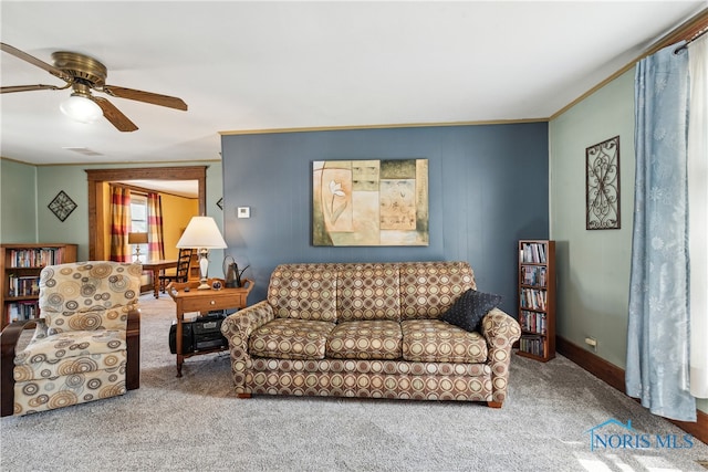 living room featuring carpet floors and ceiling fan