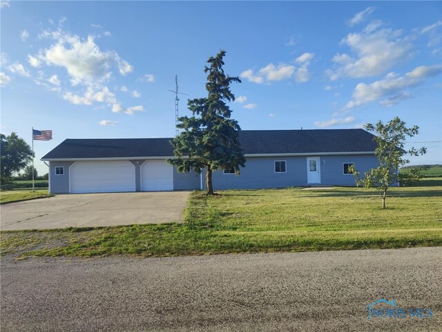 ranch-style house with a front lawn and a garage