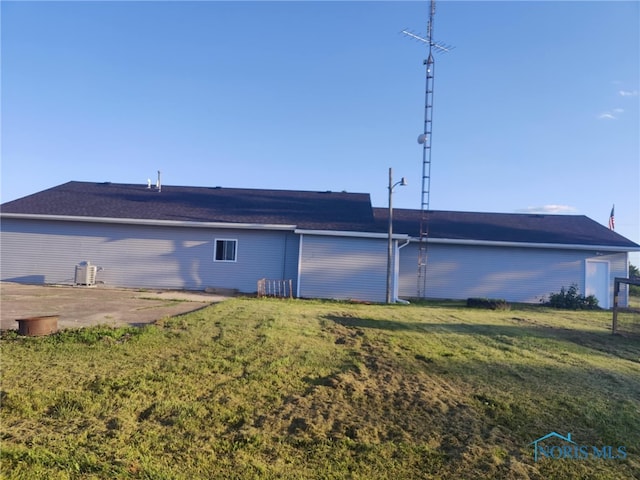 back of property featuring a patio and a yard