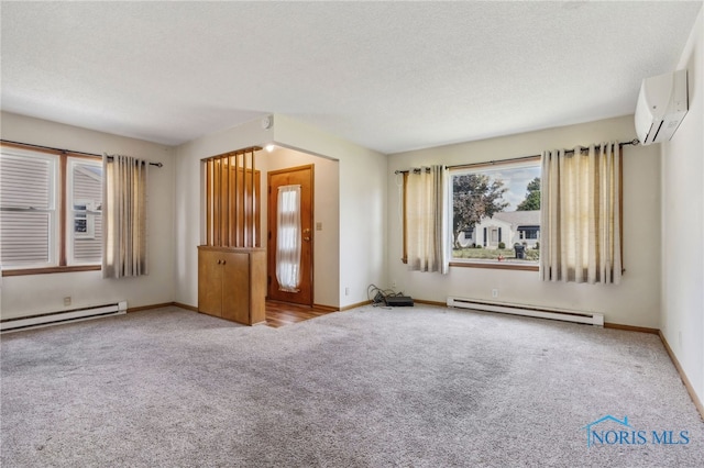 interior space featuring baseboard heating, an AC wall unit, and carpet floors