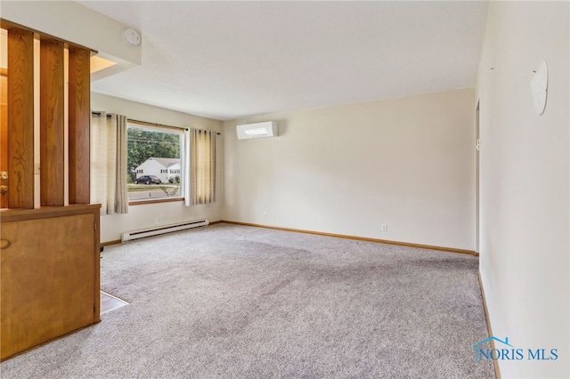 carpeted spare room with a baseboard heating unit and a wall unit AC