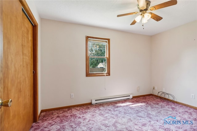 spare room with carpet flooring, a baseboard heating unit, and ceiling fan