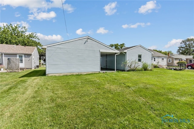 back of house with a yard