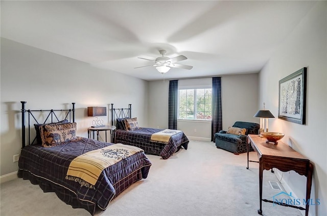 bedroom with carpet, a ceiling fan, and baseboards