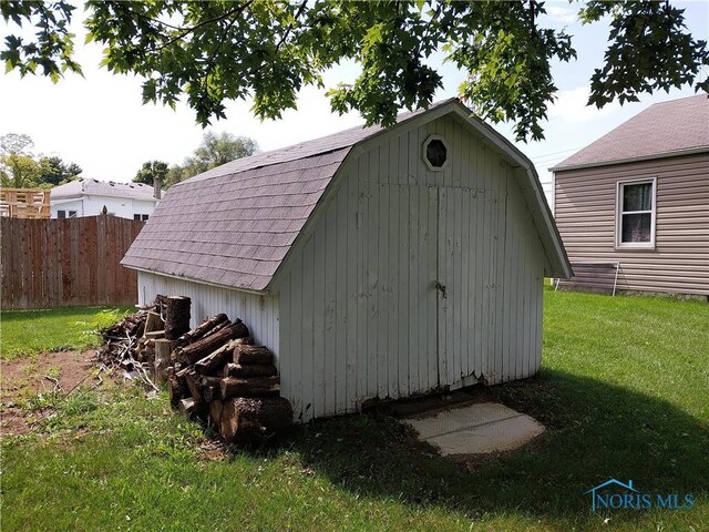 view of outbuilding featuring a yard