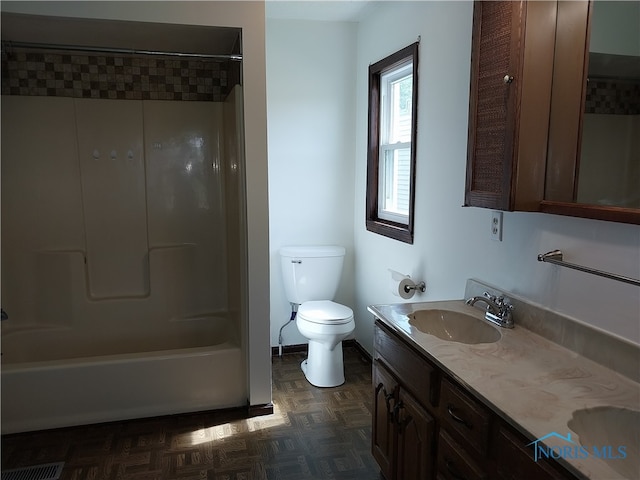 full bathroom featuring washtub / shower combination, toilet, vanity, and parquet floors