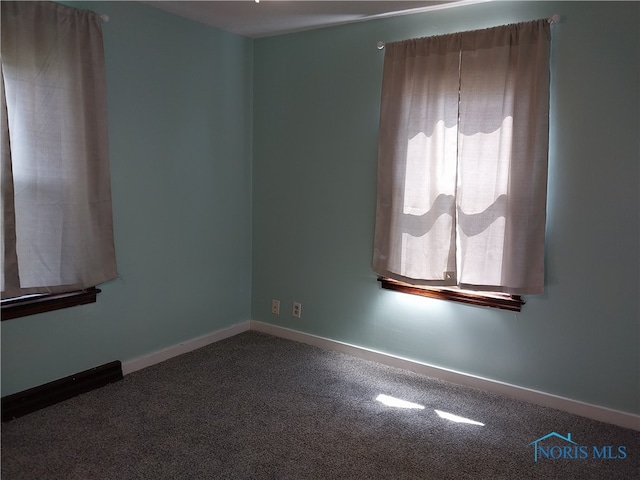 spare room featuring carpet flooring