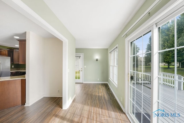 corridor featuring wood-type flooring