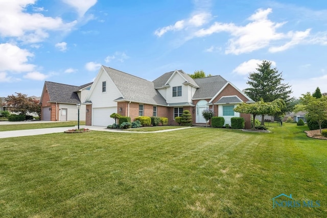 view of front of house with a front yard and a garage