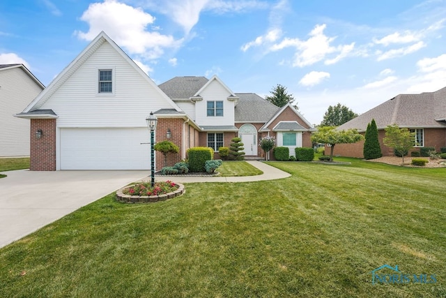 view of property with a front lawn and a garage