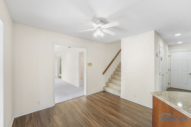 interior space with ceiling fan