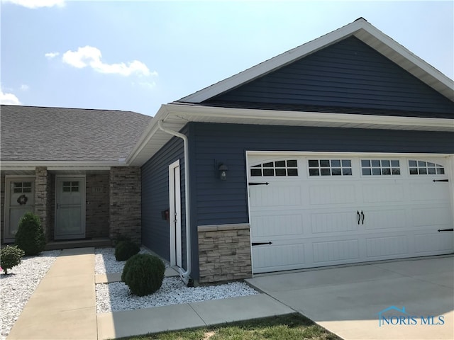 view of property exterior with a garage