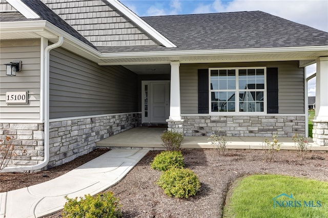 doorway to property with a porch