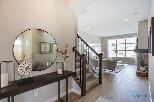 staircase featuring hardwood / wood-style flooring