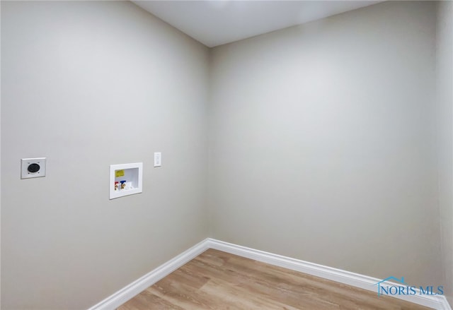 laundry room with light hardwood / wood-style floors, washer hookup, and hookup for an electric dryer