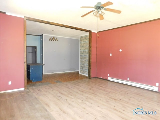 empty room with hardwood / wood-style flooring, baseboard heating, ceiling fan with notable chandelier, and brick wall