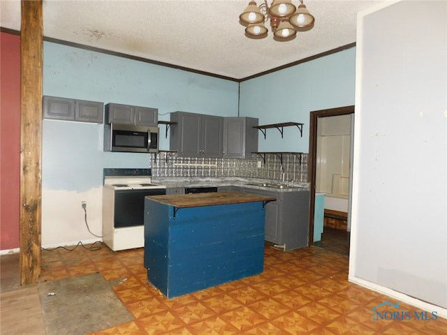 kitchen with white electric range oven, a kitchen island, tasteful backsplash, parquet floors, and gray cabinetry