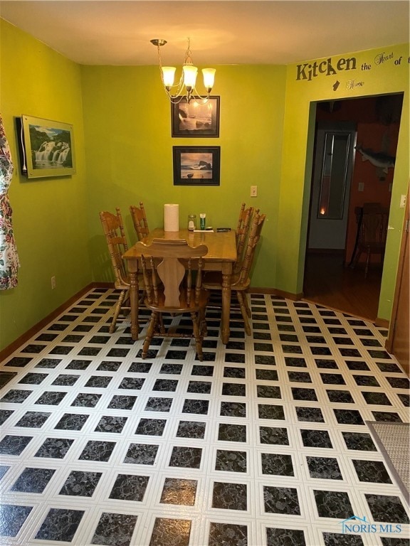 unfurnished dining area with tile patterned flooring and an inviting chandelier