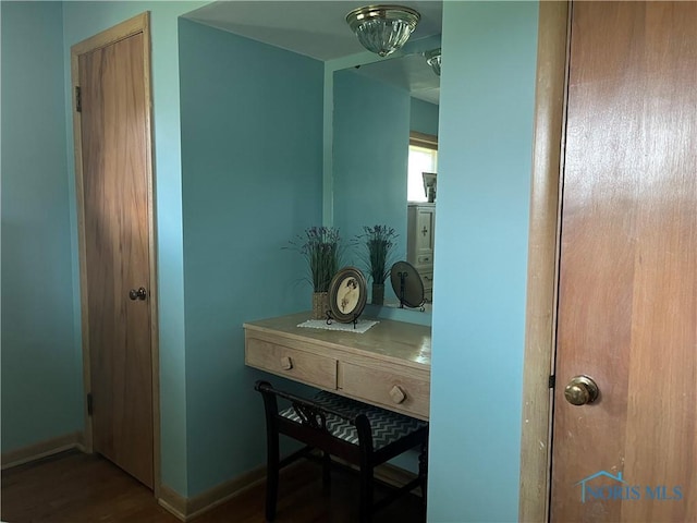 bathroom with hardwood / wood-style floors and vanity