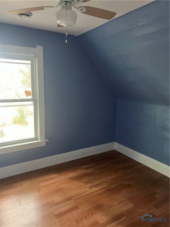 additional living space featuring ceiling fan, hardwood / wood-style floors, and vaulted ceiling