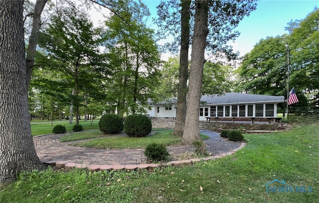 view of yard featuring a sunroom