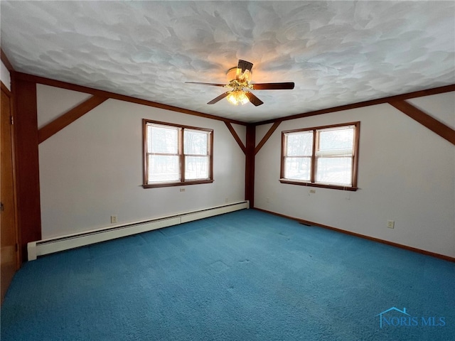 bonus room featuring ceiling fan, a textured ceiling, carpet, and a baseboard heating unit