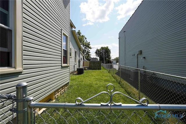 view of yard with central AC unit