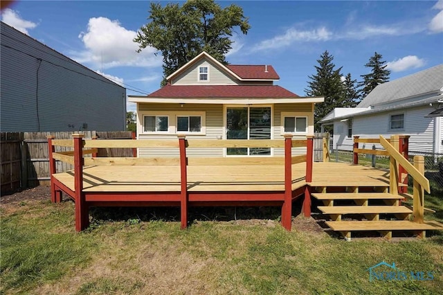 back of house featuring a wooden deck