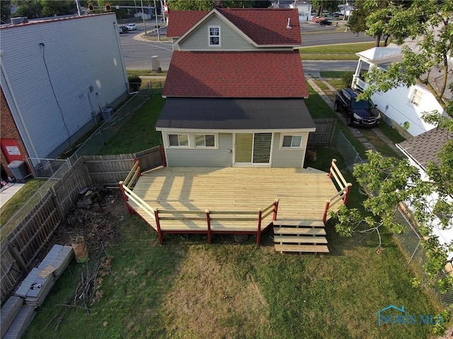 back of property featuring a wooden deck