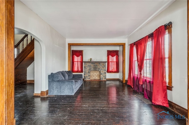 sitting room featuring wood-type flooring and a fireplace