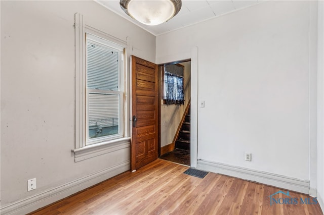 spare room with hardwood / wood-style flooring