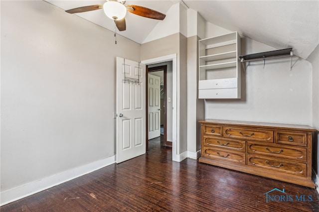 unfurnished bedroom featuring ceiling fan, dark hardwood / wood-style floors, and vaulted ceiling