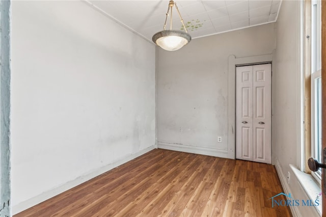 unfurnished room with hardwood / wood-style floors