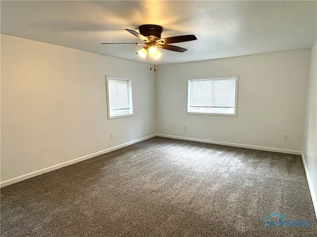 unfurnished room with ceiling fan and carpet flooring