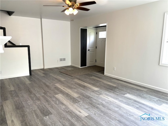 unfurnished bedroom with ceiling fan and hardwood / wood-style flooring