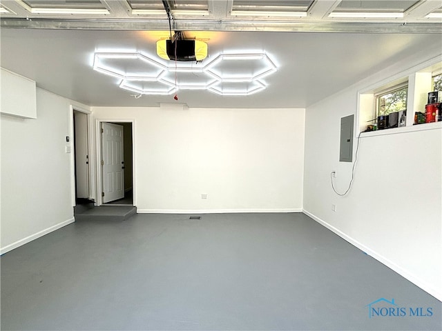 garage featuring a garage door opener and electric panel