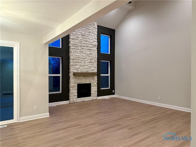 unfurnished living room featuring a fireplace and light wood-type flooring