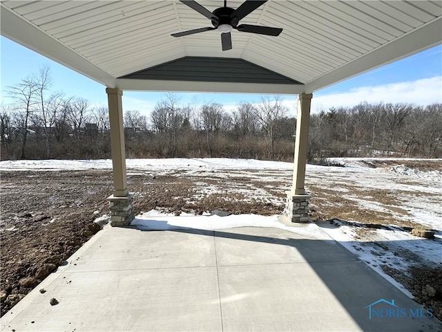 snow covered patio featuring ceiling fan