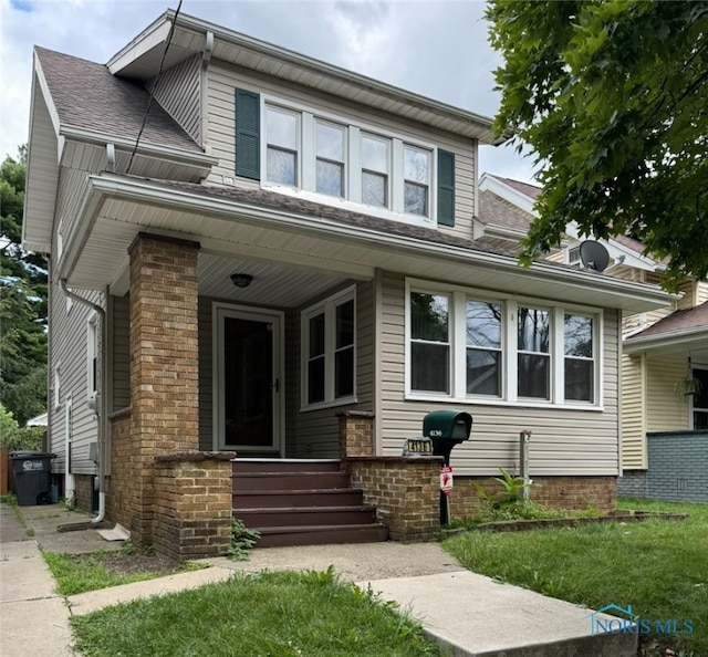 view of front of property featuring covered porch