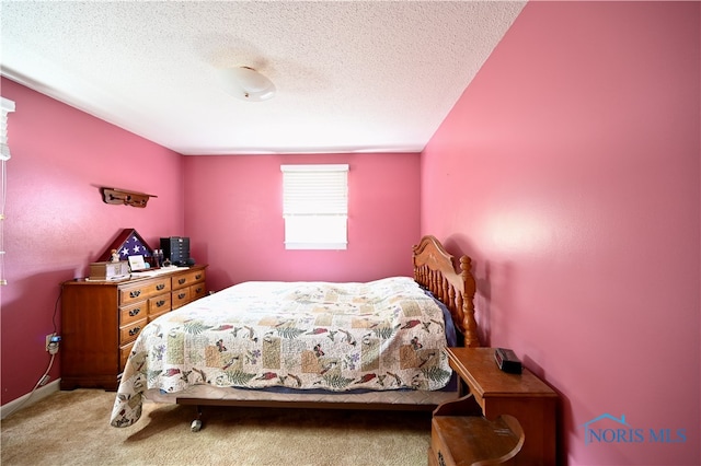 carpeted bedroom with a textured ceiling