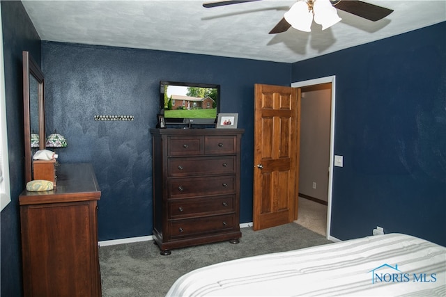 carpeted bedroom with ceiling fan