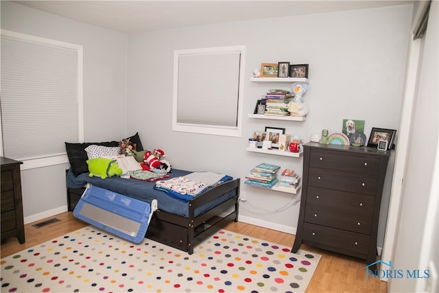 bedroom featuring light wood-type flooring