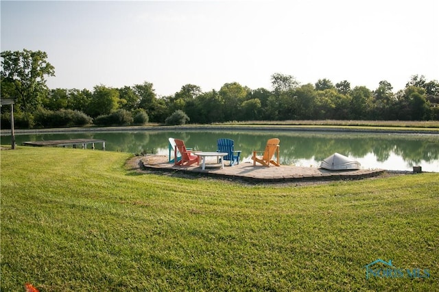 exterior space featuring a yard and a water view