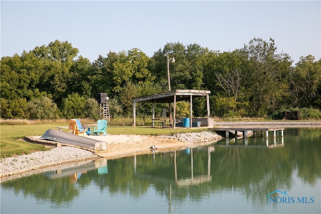 dock area featuring a yard, a gazebo, and a water view