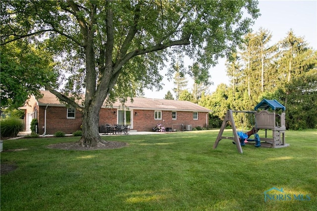 view of yard featuring a patio area and a playground