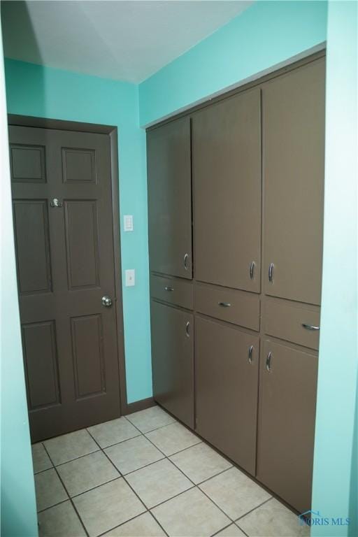 interior space featuring light tile patterned flooring