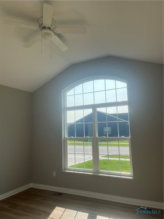 interior space featuring ceiling fan, vaulted ceiling, and hardwood / wood-style floors